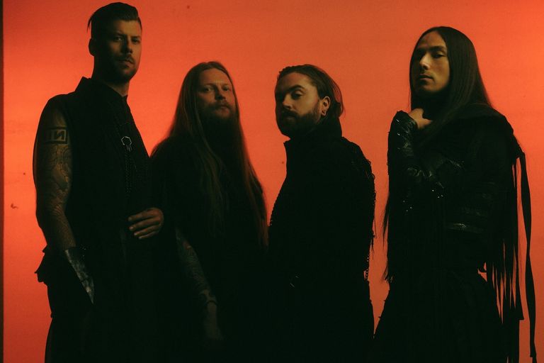 Swedish metalcore band Imminence posing in dark outfits silhouetted against a vibrant red background.