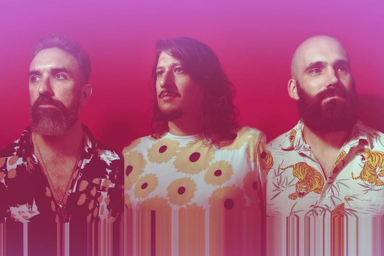Promotional portrait of Australian post-rock band SEIMS against a vibrant pink backdrop.