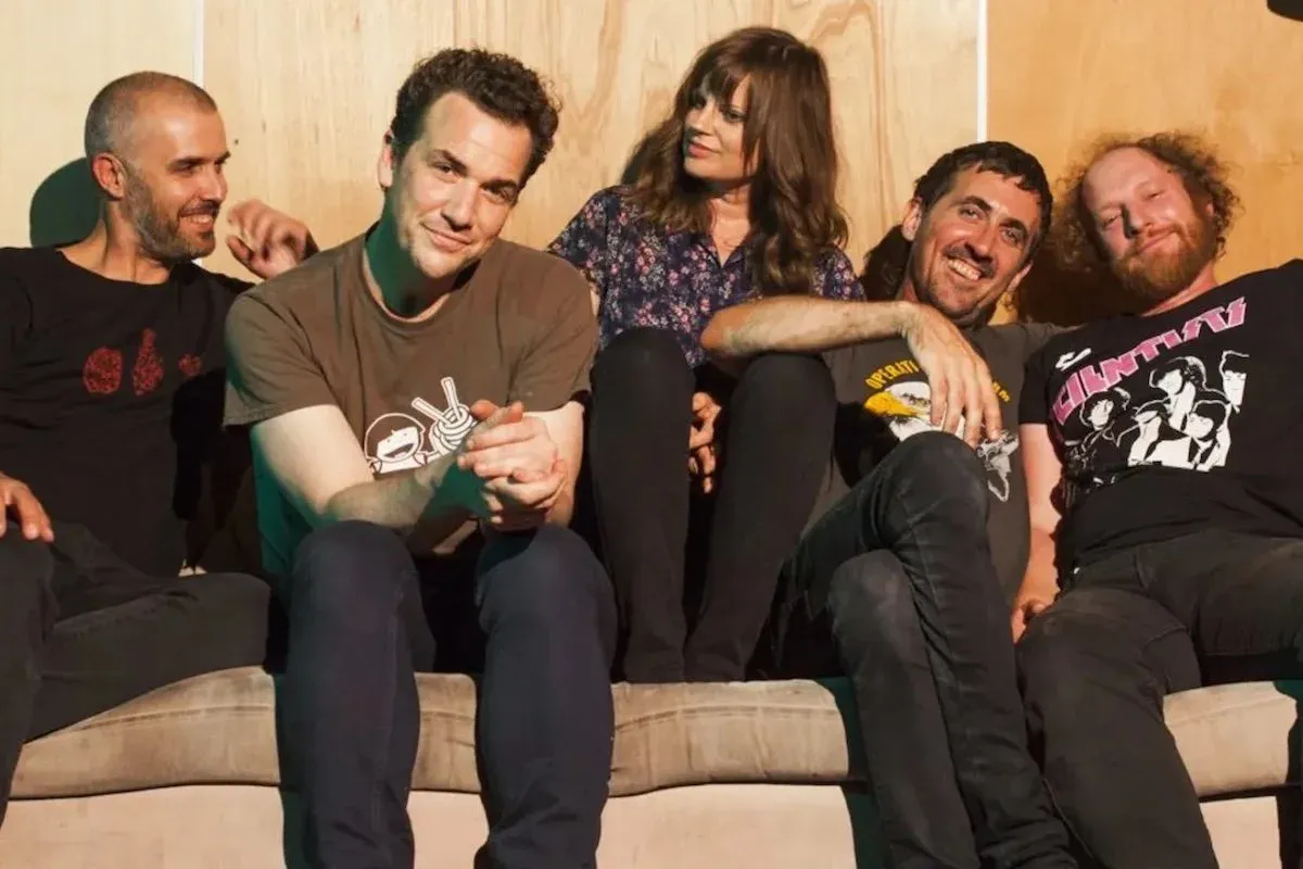 Australian band The Drones sitting on a couch