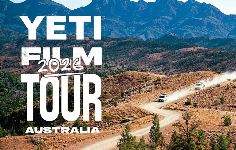 Yeti Film Tour 2026 Australia promotional poster featuring white 4WD vehicles driving along a dusty outback dirt road through mountain ranges.