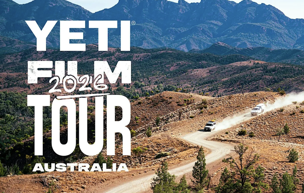 Yeti Film Tour 2026 Australia promotional poster featuring white 4WD vehicles driving along a dusty outback dirt road through mountain ranges.